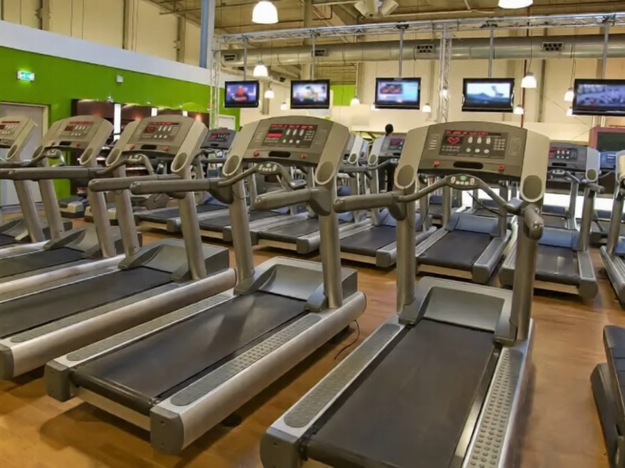 Clean gym floor with treadmills