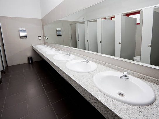 Clean restroom sinks and stalls